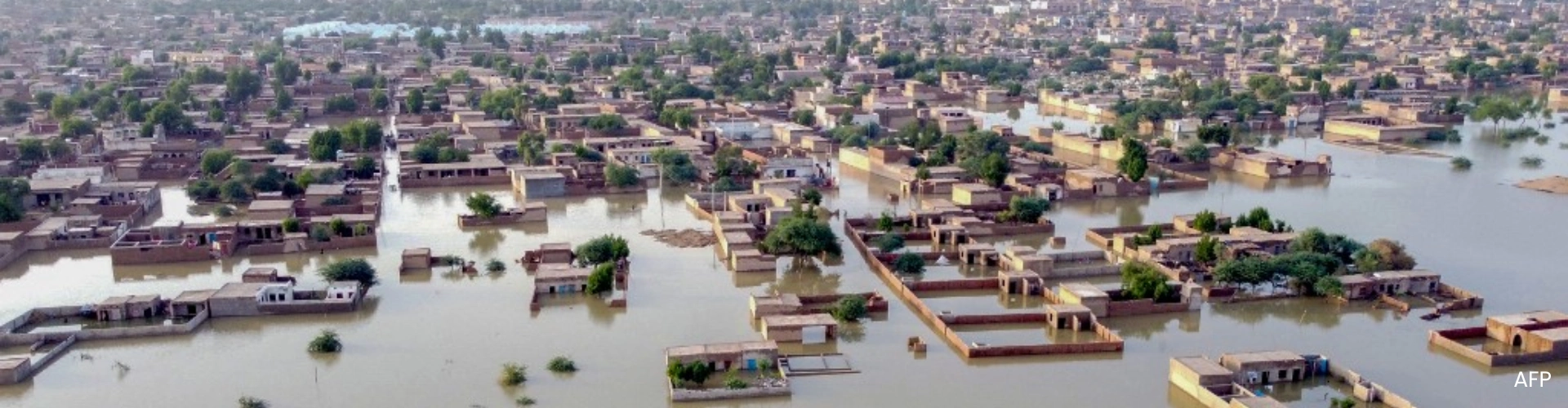 Water covering homes and an entire town during the Pakistan Monsoon